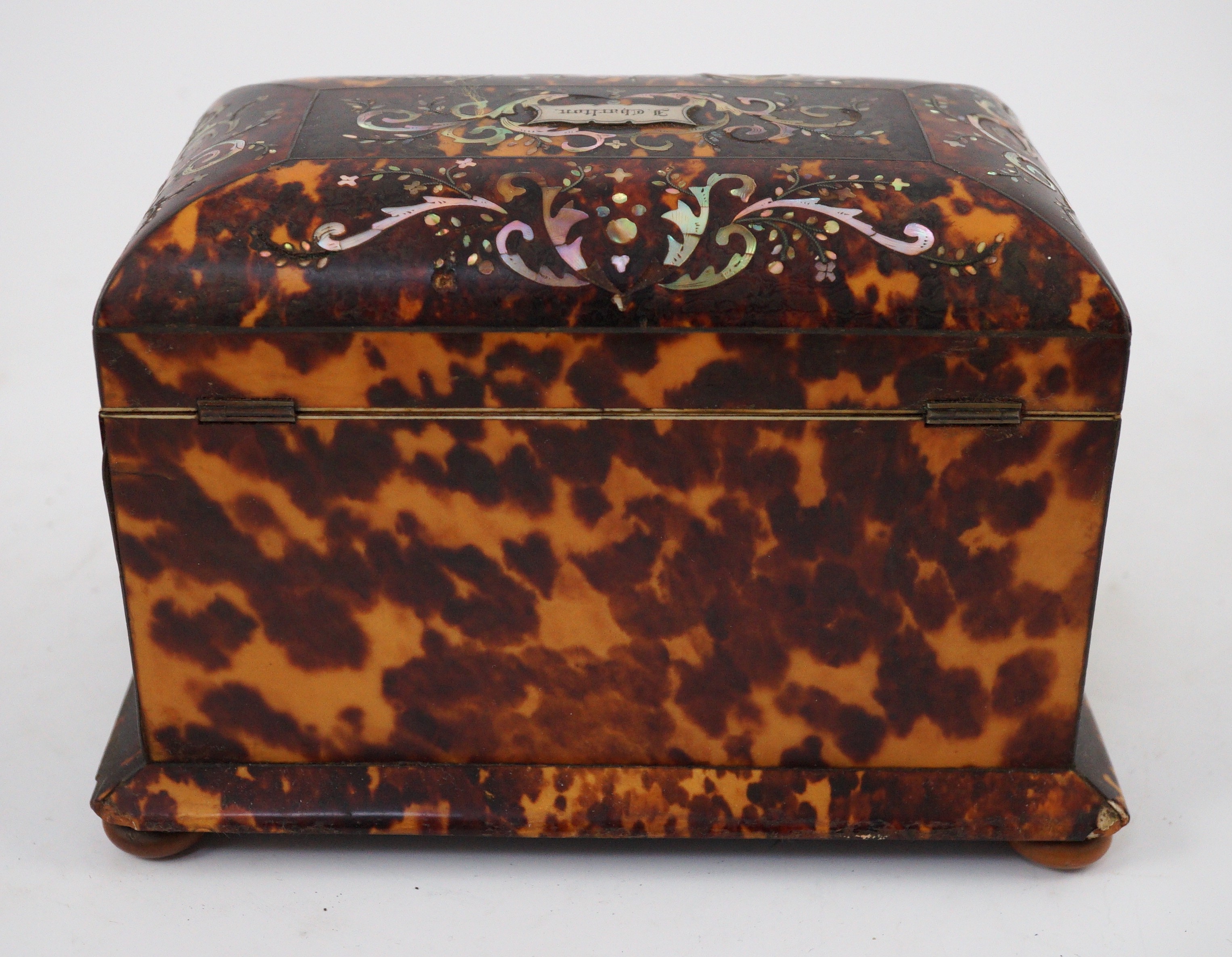 A Regency mother of pearl inset blond tortoiseshell tea caddy, 20cm wide 12.5cm deep 13.5cm high